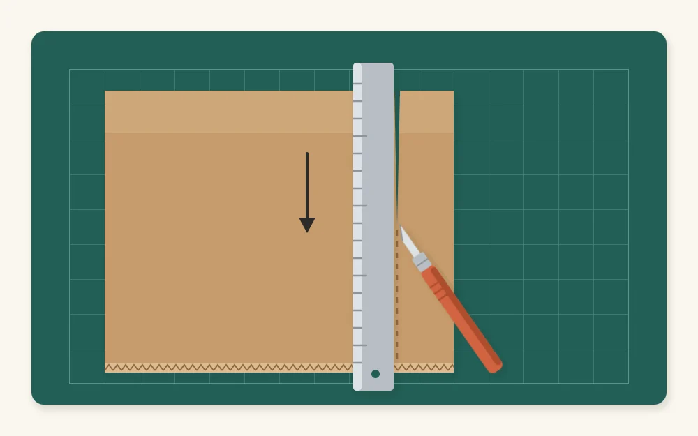 A craft knife cutting a strip of corrugated cardboard along a metal ruler on a cutting mat