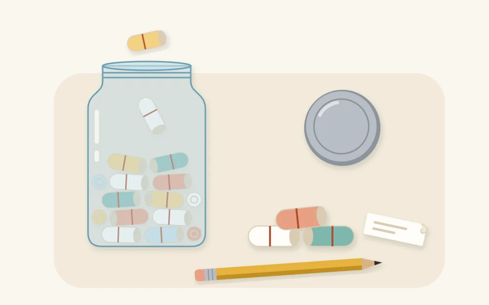 A glass jar being filled with small rolled paper slips, loose slips and a pencil beside it