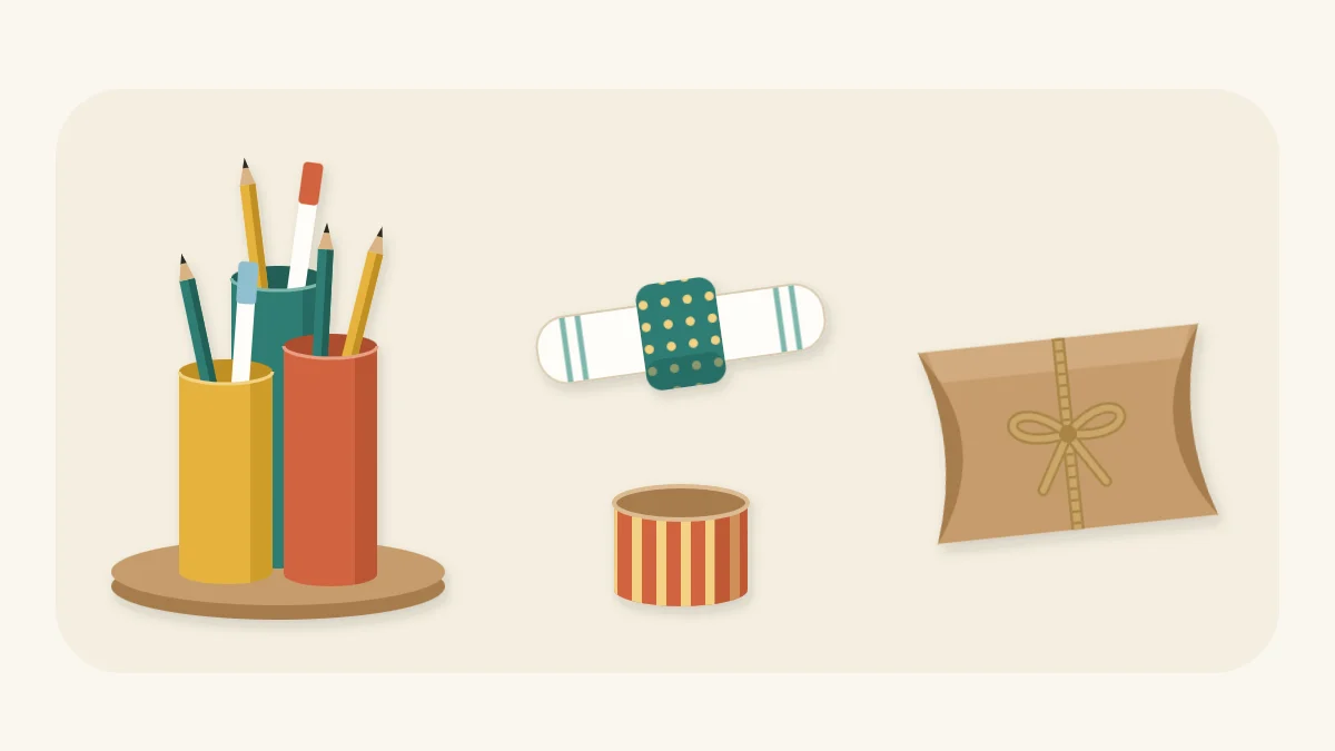 Three painted tubes on a round base holding pens, two paper-wrapped napkin rings and a pillow gift box tied with twine